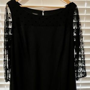 Black cocktail dress with decorative sleeves